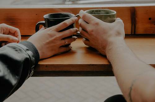 cup person holding mugs photo tulsa